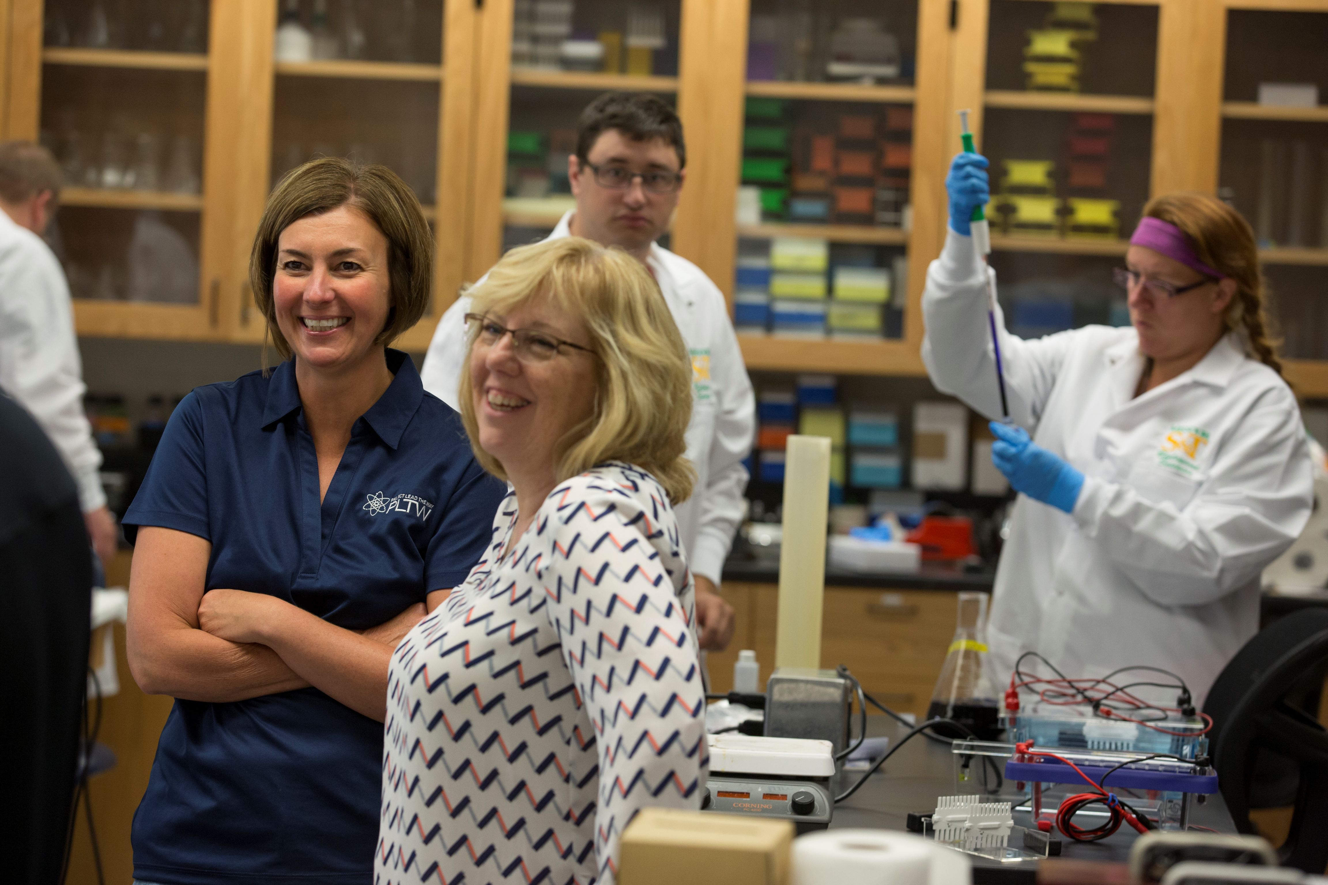 Women smiling at a Project Lead the Way Biomedical Training